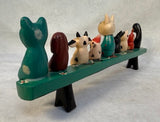 Hand-Painted Animals on a Bench