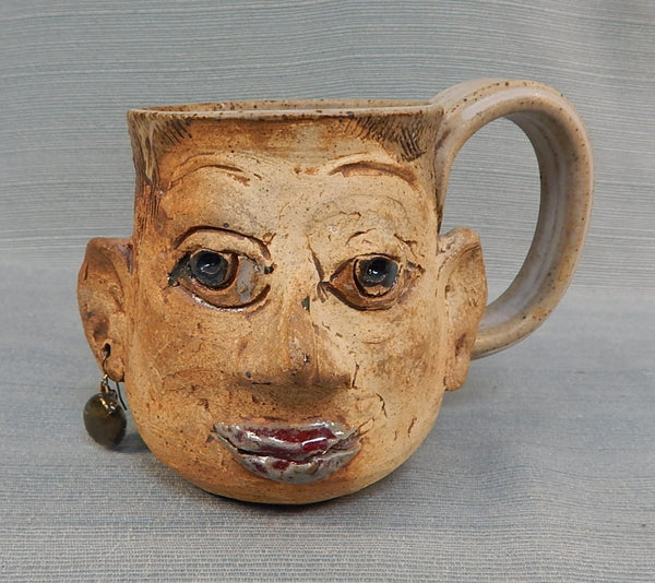 Face Mug with Earring by L. Chris