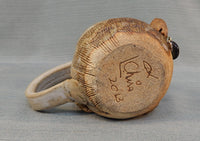 Face Mug with Earring by L. Chris
