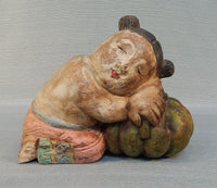 Asian Wood Figure of Girl Sleeping on a Pumpkin