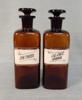 Pair of Vintage W.T. & Co. Apothecary Bottles