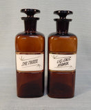 Pair of Vintage W.T. & Co. Apothecary Bottles